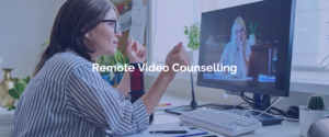 A female therapist doing remote video counselling with a client in front of a computer.